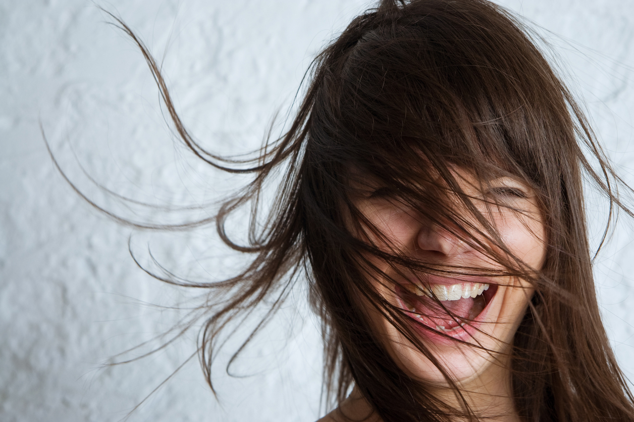 Closeup portrait of a happy young woman